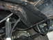 1978 Ford Bronco - Close-up view of the undercarriage, focusing on the frame and suspension components.