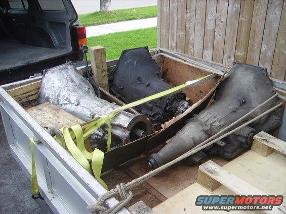 Three transmissions loaded in a truck bed