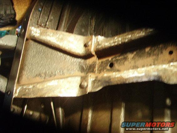 Close-up of rusty frame and suspension parts