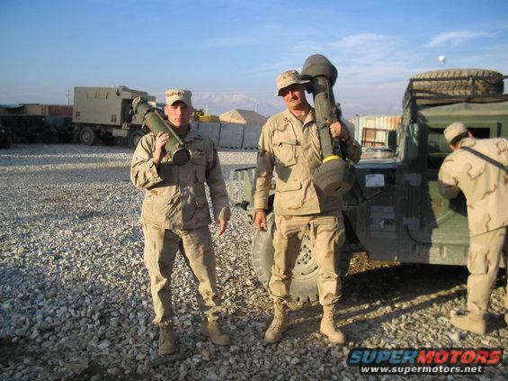 Military vehicle with soldiers holding missile launchers