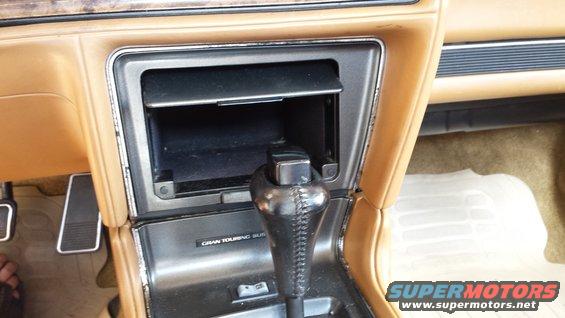 1991 Buick Reatta interior center console showing gear shifter and storage compartment