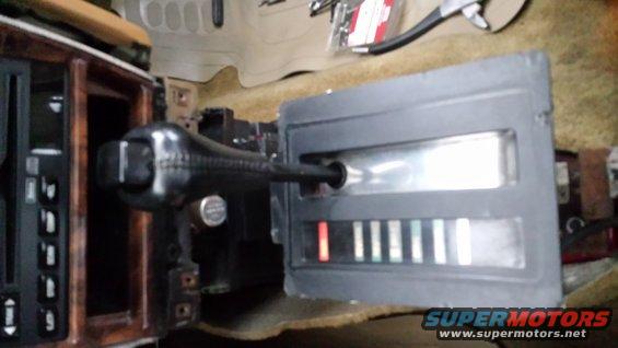 car's center console with gear shifter and indicator lights