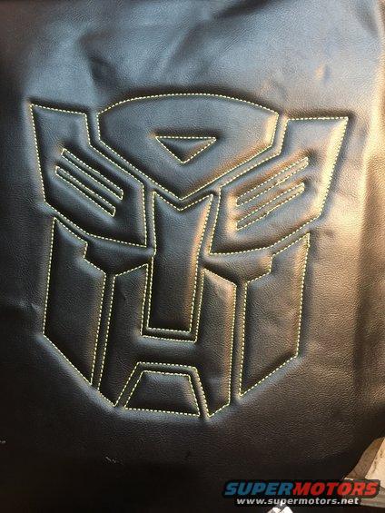 Black material with stitched Transformers Autobot logo