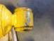 1973 Ford Bronco - Close-up of a yellow shock absorber showing significant paint wear.