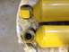 1973 Ford Bronco - Close-up view of two yellow shock absorbers with visible wear on the rubber bushings.