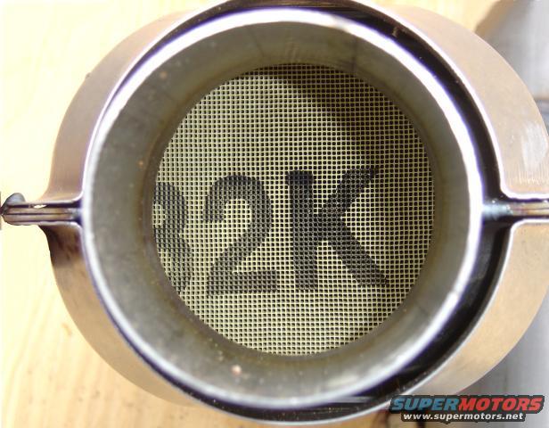 Catalytic converter interior with "12K" visible on honeycomb structure