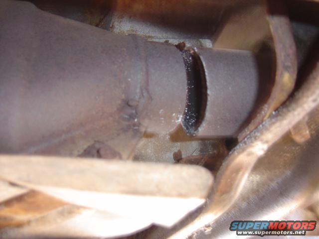 Exhaust pipe with a hole cut into it