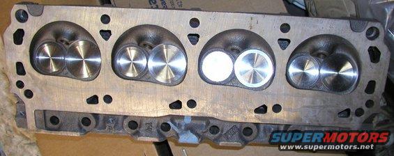 Engine cylinder head with four intake and exhaust ports, some with polished valves