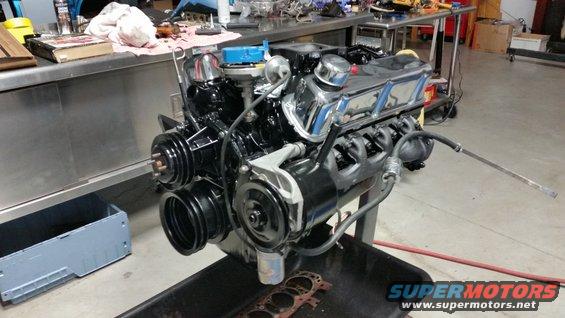 V8 engine on stand, black block, chrome valve covers, blue distributor cap
