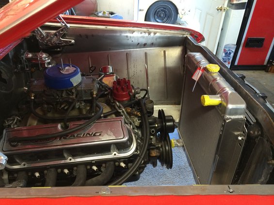 Red 1964 Ford Fairlane engine bay with V8 engine and aluminum radiator