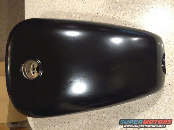 Black motorcycle fuel tank with two mounting points visible