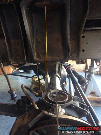Trying to line up the Dana 44 differential with a plumb bob 