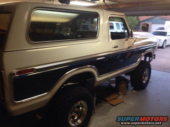 1978 Ford Bronco parked in a garage, side view