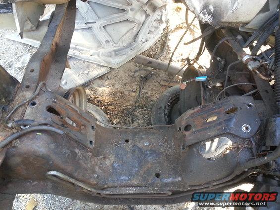 rusted vehicle frame with suspension components and wiring