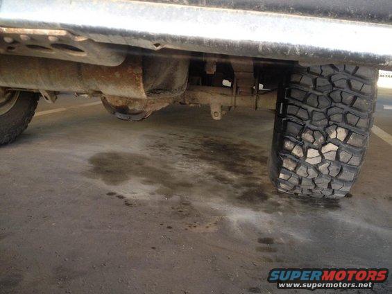 Rear axle, leaf springs, and off-road tire on a 4x4 vehicle