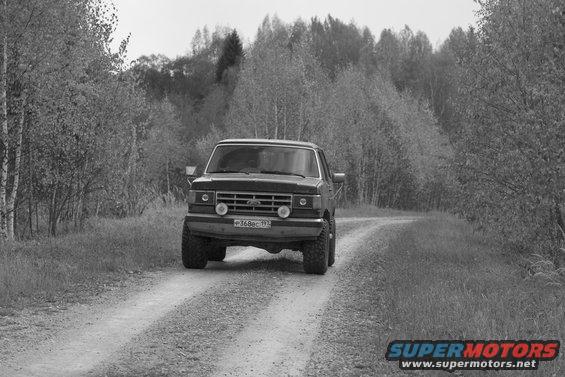 Ford F-Series truck on a dirt road, front view. License plate reads P368BC 192