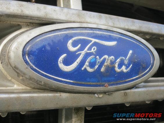 Close-up of 1987 Ford Bronco grille with blue Ford emblem