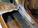 1991 Ford Bronco - This photo shows significant rust damage to the floor pan and frame of a vehicle, indicating structural compromise.
