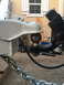 2014 Transnational Firestar 150CC - Close-up of a trailer hitch mechanism, showing the ball and coupler connection.