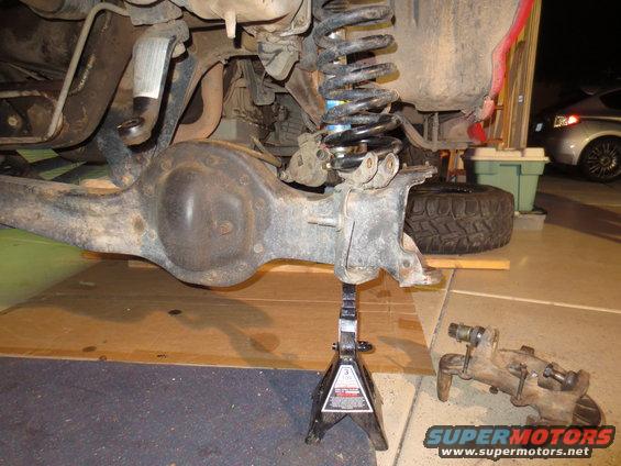 Rear axle assembly on jack stands, with suspension components visible