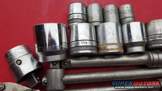 Collection of Craftsman sockets and a ratchet on a red surface