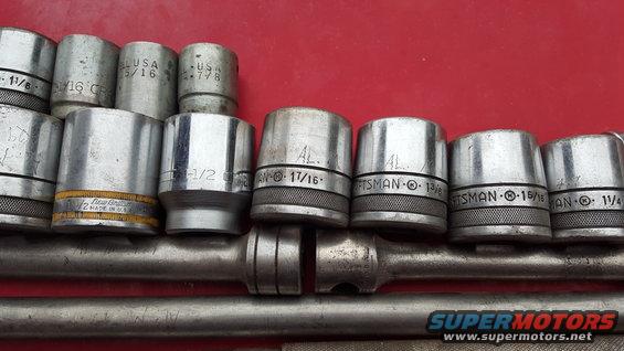 Close-up of a socket set with various sizes visible, including Craftsman brand sockets