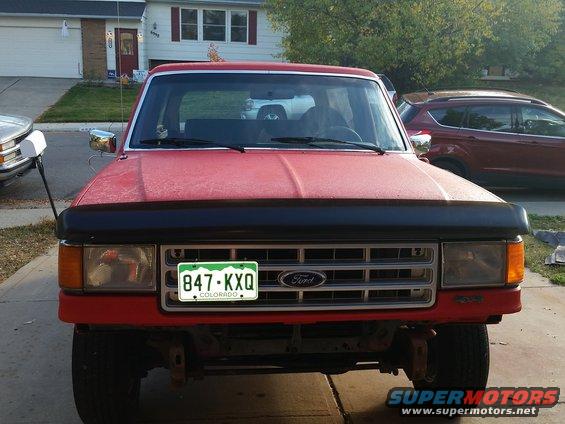 Red 1988 Ford Bronco front view with Colorado license plate 847-KXQ