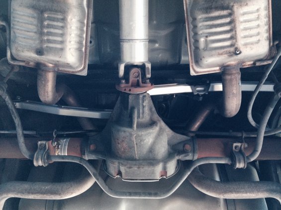 Undercarriage view of a vehicle's rear differential and dual exhaust system