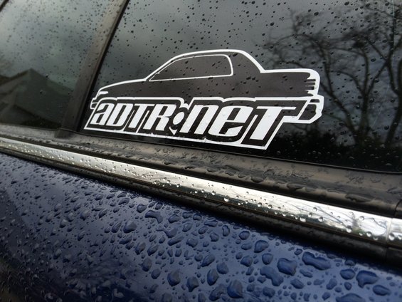 Car window sticker with silhouette and "ADTR.net" text