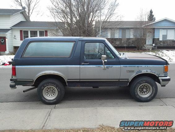 1988 Ford Bronco side view, blue and silver two-tone paint