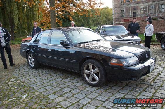 Black 2003 Mercury Marauder parked on cobblestones