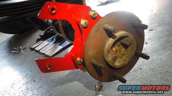Rear caliper bracket adjusted, in place and ready for a caliper (and a little touch up paint - I used fingernail polish)