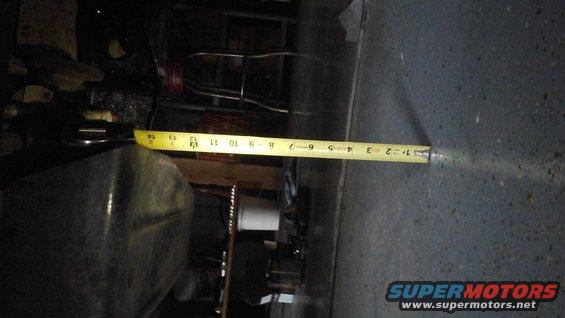 It's measured from the transfer case skid plate to the floor.  Sorry for the sideways picture.
