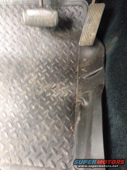 Diamond plate floor mat and pedals inside a vehicle