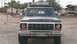 1978 Ford Bronco - This 1978 Ford Bronco features a prominent grille and a roof rack, seen from a front-facing perspective.