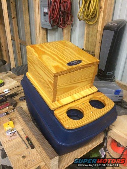 All assembled and stained.  I liked the light color and stained it with the lightest stain I could find.  Multiple coats of polyurethane.  Lightly sanded between coats.  Very thick on top - 6-7 coats. I lost count.  