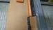 1992 Ford Bronco - A close-up view of a table saw fence and its guide rail.
