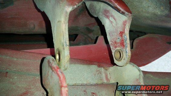 Once both pins were out, the door could move.  However, both pins needed to be removed for the bushings to be accessible.  If one pin was still in, the door couldn't move enough to get out of the way.