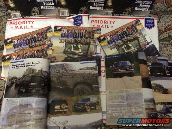 Several magazines and mailers about Ford Broncos, some showing them covered in mud