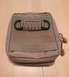 2003 Ford Crown Victoria - A close-up view of a tan tactical pouch with paracord and D-rings.