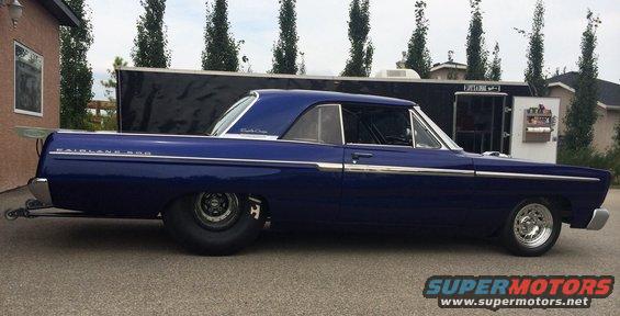 Blue 1965 Ford Fairlane 500 drag car with custom spoiler and wide rear tires