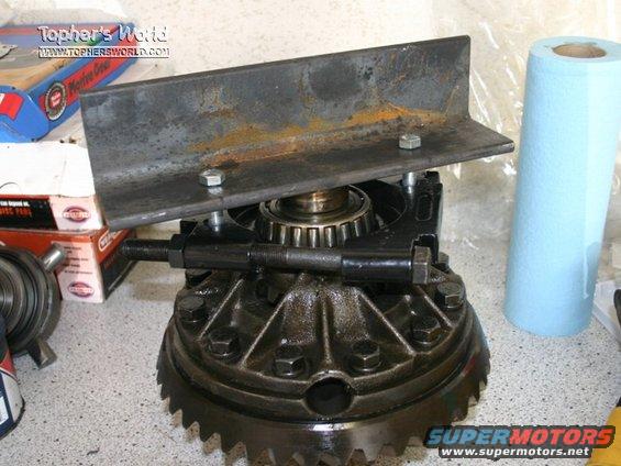 14b_carrier_001.jpg this isn't my carrier, but we used the same principle to pull the carrier bearings off. but even with an impact, we were able to bend 3/8 plate trying to get both of them off. 