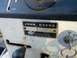 1982 Kubota RTV900 - Close-up of a John Deere data plate and control panel, showing a choke lever and ignition switch.