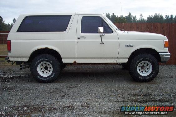 1990 Ford Bronco side profile, white exterior, aftermarket wheels
