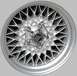 1999 Mercury Grand Marquis - Close-up of a Mercury brand wheel, likely an aftermarket or factory option.