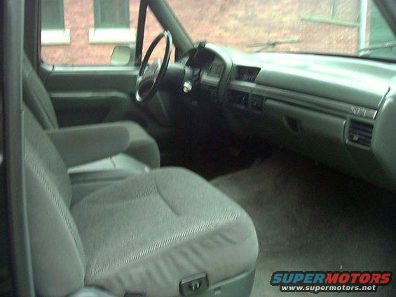 Interior view of a truck's passenger seat and dashboard