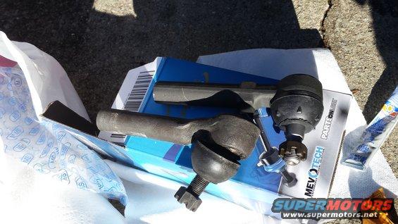 Tie rod ends and ball joint on a blue box with text 'MEVOTECH PARTSONLINE'