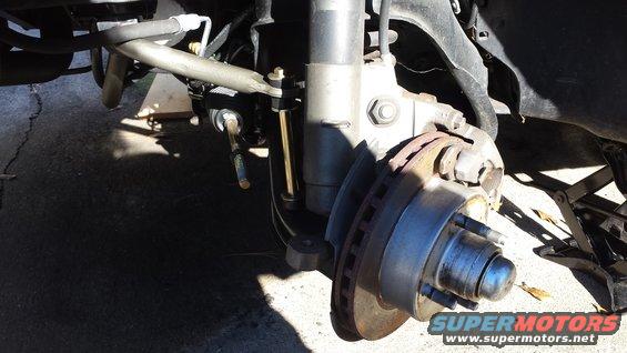 Front suspension and brake assembly with rotor and caliper