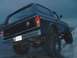 1978 Ford Bronco - This 1978 Ford Bronco is shown from a low rear angle, with its rear tire on a rock.