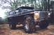 1978 Ford Bronco - Modified 1978 Ford Bronco with lifted suspension and aggressive tires sits off-road.